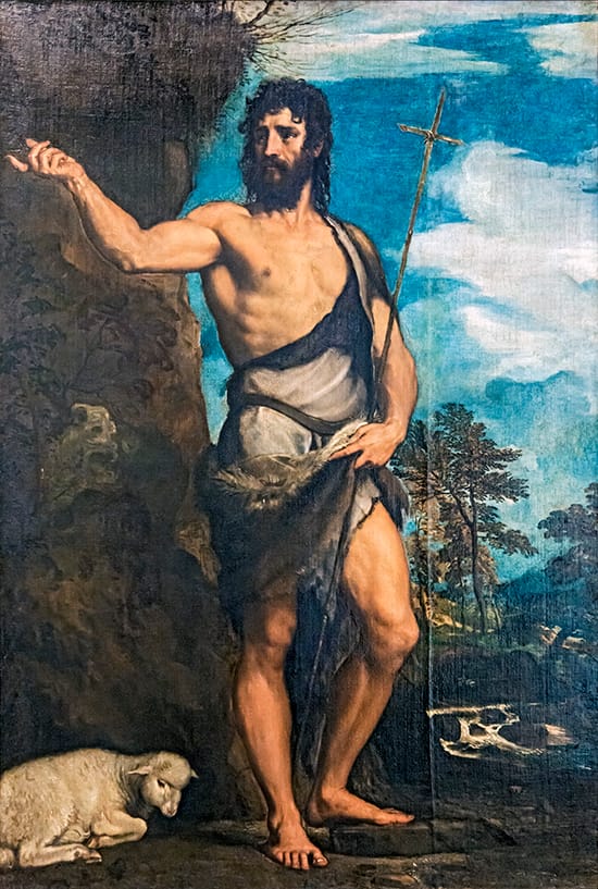 San Juan Bautista vestido con piel o pelo de camello y cinturón de cuero en el desierto.