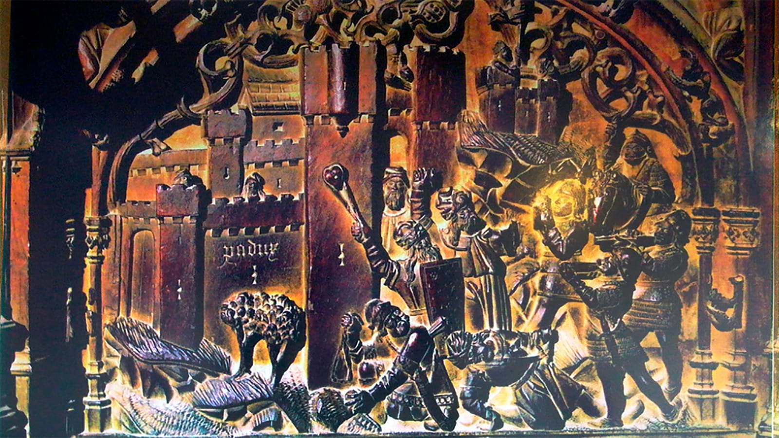 Silla tallada del coro de la Catedral de Toledo que representa la toma de Padul, con escenas de combate y fortificación.